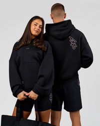 Duo wearing Pride Sticker Boxy Hoodie - Black | Model:Bianca | Size:XS | Model:Albert | Size:M