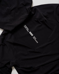 Flatlay of On the Run Long Sleeve in Black back panel with reflective details