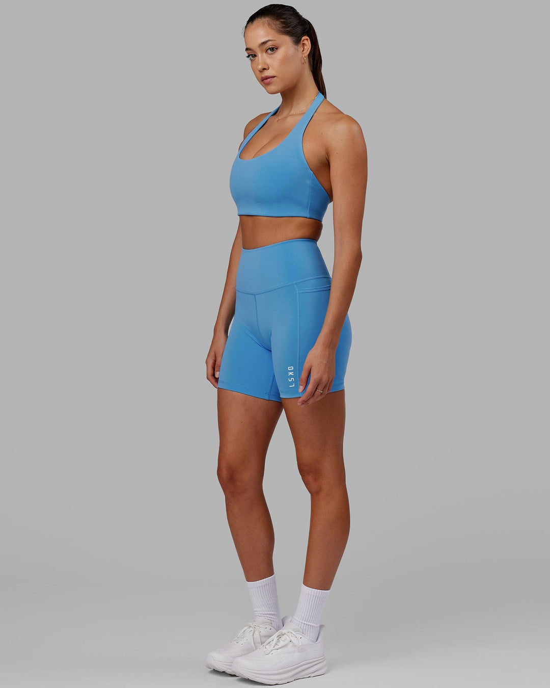 Woman wearing Flux Ultra High-Rise 6" Short Pockets - Azure Blue