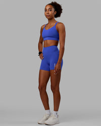 Woman wearing Flux Ultra High-Rise 4" Short Pockets - Power Cobalt
