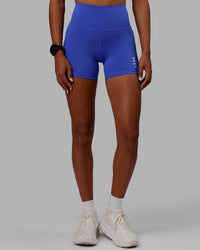 Woman wearing Flux Ultra High-Rise 4" Short Pockets - Power Cobalt