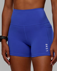 Woman wearing Flux Ultra High-Rise 4" Short Pockets - Power Cobalt