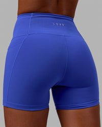 Woman wearing Flux Ultra High-Rise 4" Short Pockets - Power Cobalt