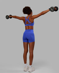 Woman wearing Flux Ultra High-Rise 4" Short Pockets - Power Cobalt