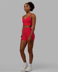 Woman wearing Flux Ultra High-Rise 4" Short Pockets - Scarlet