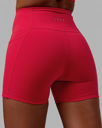 Woman wearing Flux Ultra High-Rise 4" Short Pockets - Scarlet