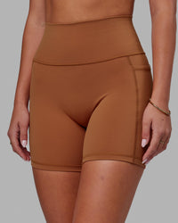 Woman wearing Fusion Ultra High-Rise 6" Short Pockets - Hazel | Model:Milly | Size:S
