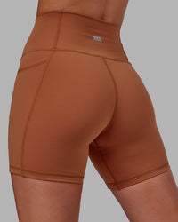 Woman wearing Fusion Ultra High-Rise 6" Short Pockets - Hazel | Model:Milly | Size:S