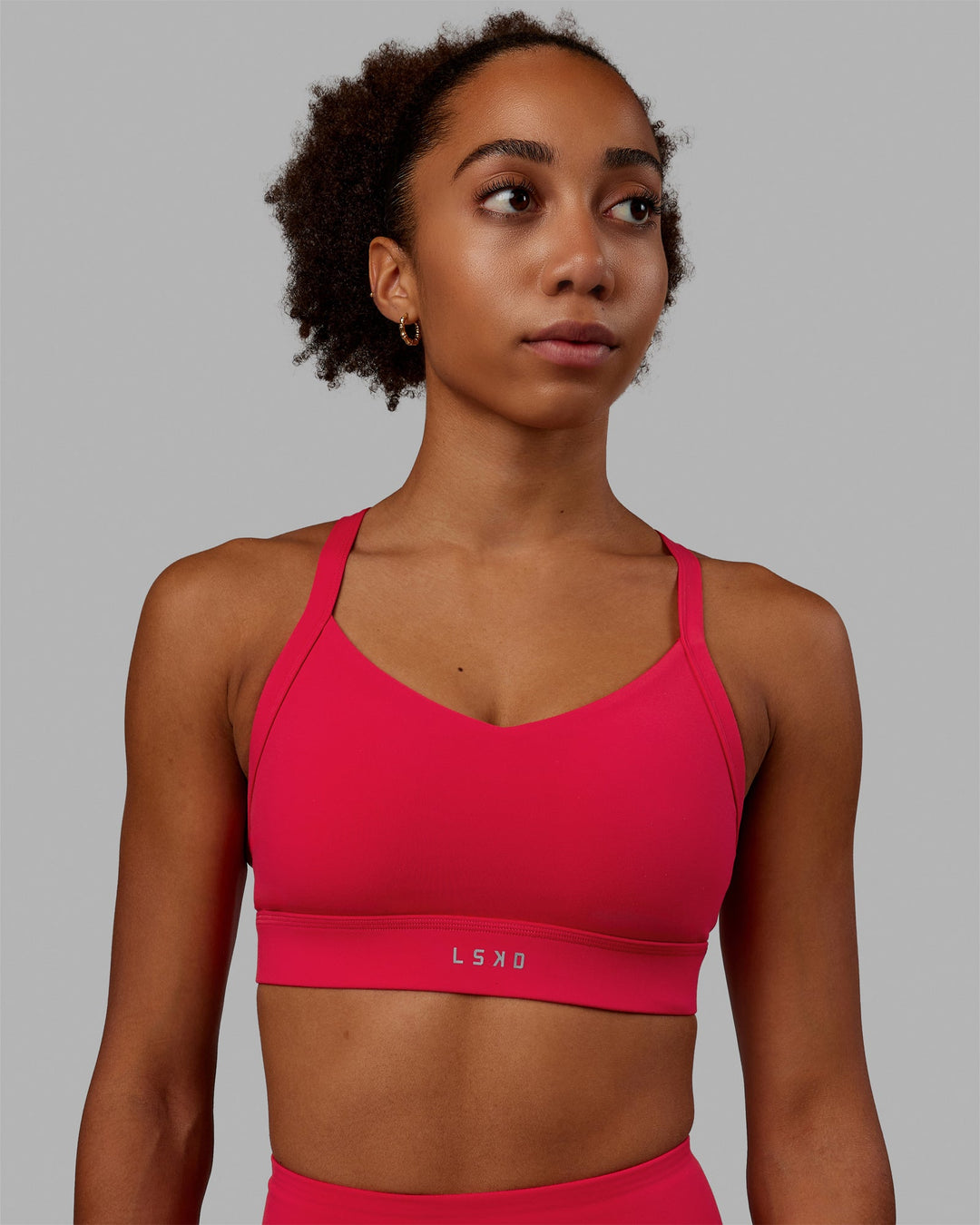 Woman wearing Interval Sports Bra - Scarlet