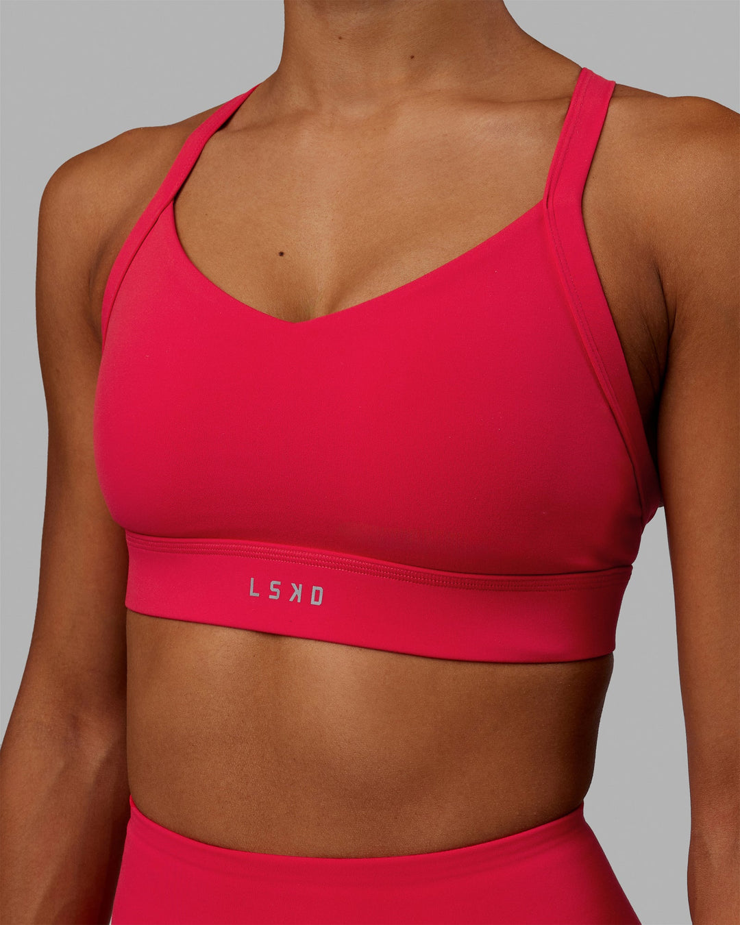 Woman wearing Interval Sports Bra - Scarlet