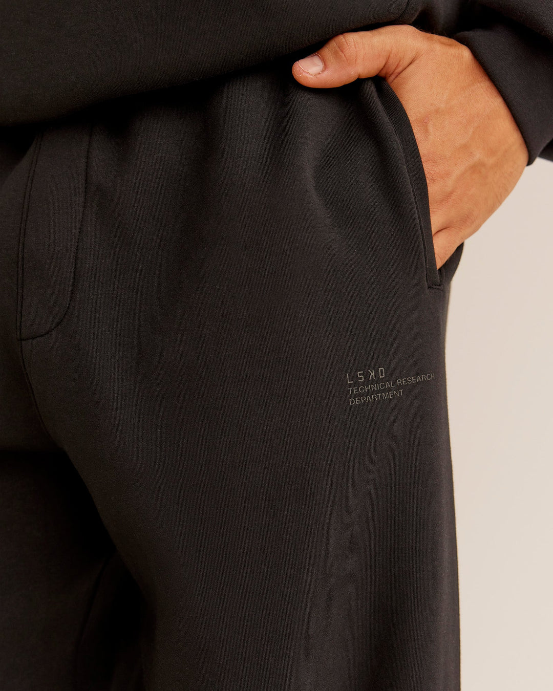 Man wearing AfterDark ZeroCrease Straight Leg Pant - Black | Model:Jackson | Size:L