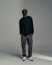 Man wearing All Day ZeroCrease™  Regular Pant - Dark Storm | Model:Okello | Size:L