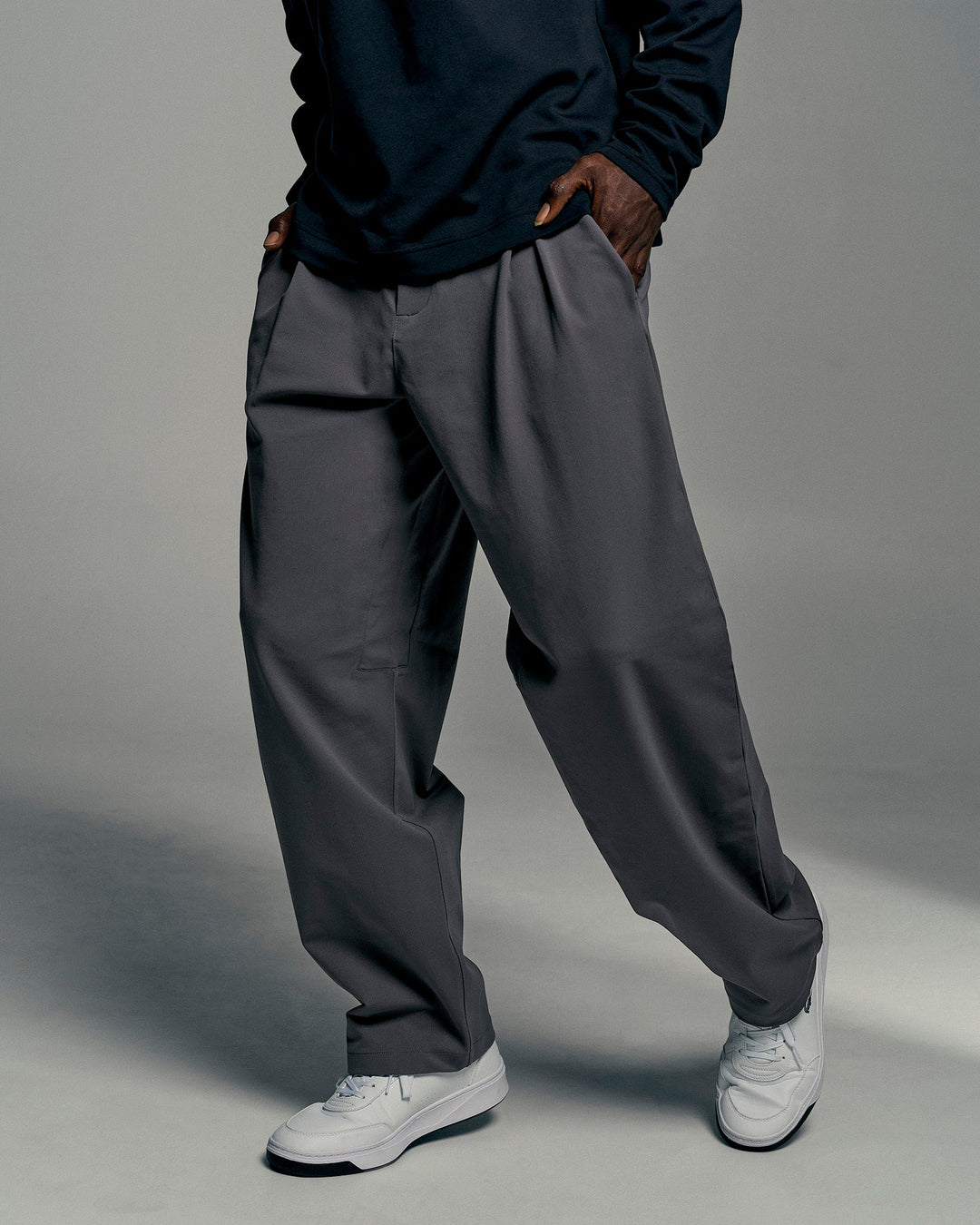 Man wearing All Day ZeroCrease™ Wide Leg Pant - Dark Storm | Model:Okello | Size:L