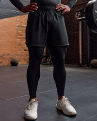 Man wearing BaseTech 26" Leggings - Black | Model:Paris | Size:L