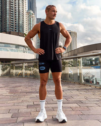 Man wearing Cadence Run Club Script Values Tank - Black-Palace Blue | Model:Cooper | Size:L