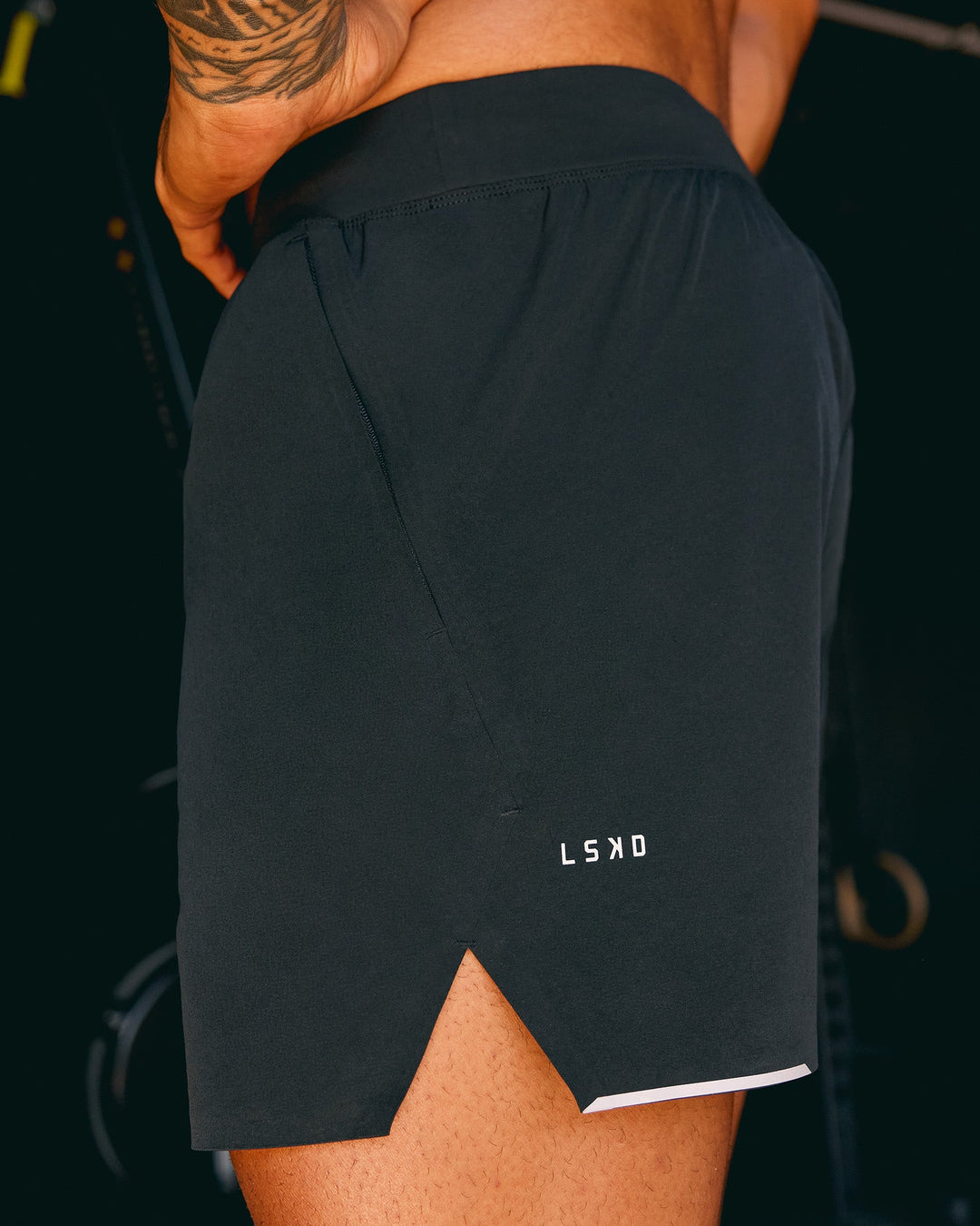 Man wearing Hybrid 5&quot; Short - Black-Reflective | Model:Xav | Size:L