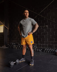 Man wearing Rise & Lift Washed FLXCotton Oversized Tee - Graphite-Purple Opulence | Model:Mathias | Size:L