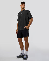 Man wearing 1% Better Every Day EST FLXCotton Oversized Tee - Black Washed | Model:Jackson | Size:L