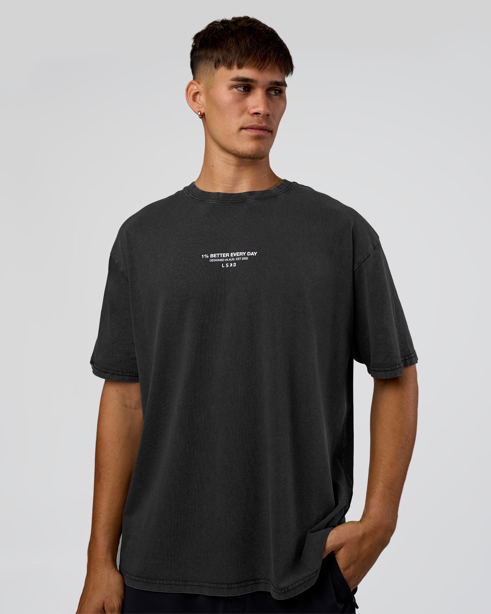 Man wearing 1% Better Every Day EST FLXCotton Oversized Tee - Black Washed | Model:Jackson | Size:L