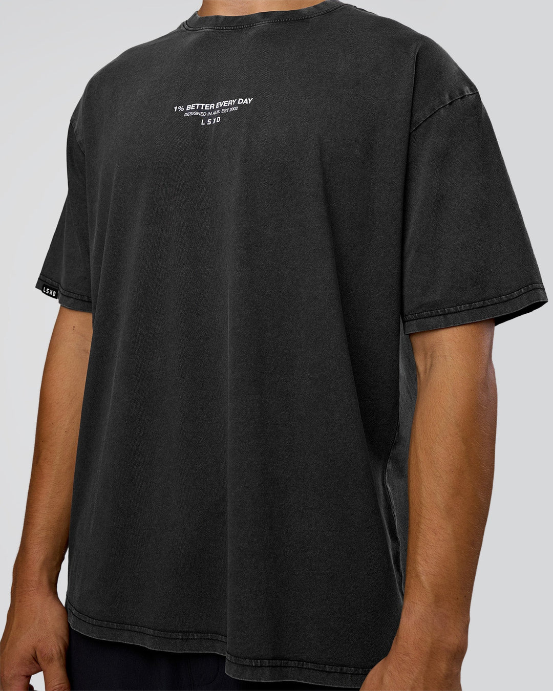 Man wearing 1% Better Every Day EST FLXCotton Oversized Tee - Black Washed | Model:Jackson | Size:L