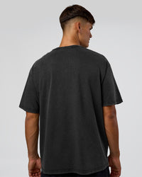 Man wearing 1% Better Every Day EST FLXCotton Oversized Tee - Black Washed | Model:Jackson | Size:L