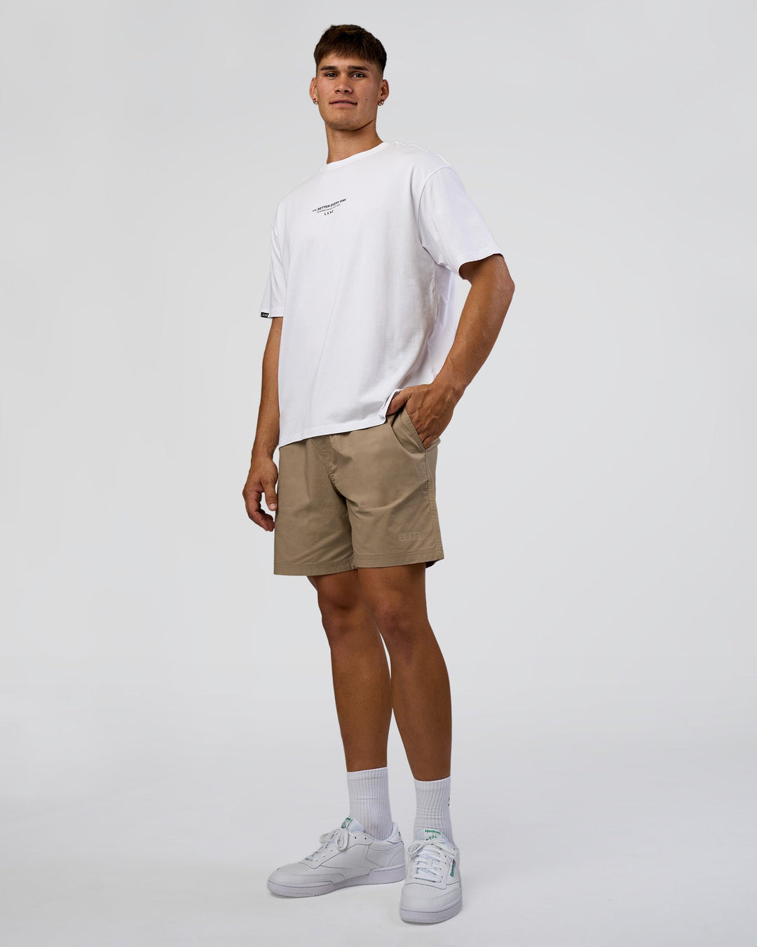 Man wearing 1% Better Every Day EST FLXCotton Oversized Tee - White | Model:Jackson | Size:L