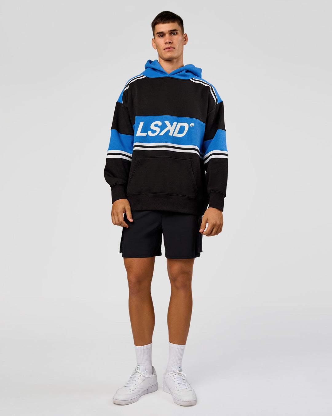 Man wearing A-Team Oversized Hoodie - Caviar-Palace Blue | Model:Jackson | Size:L
