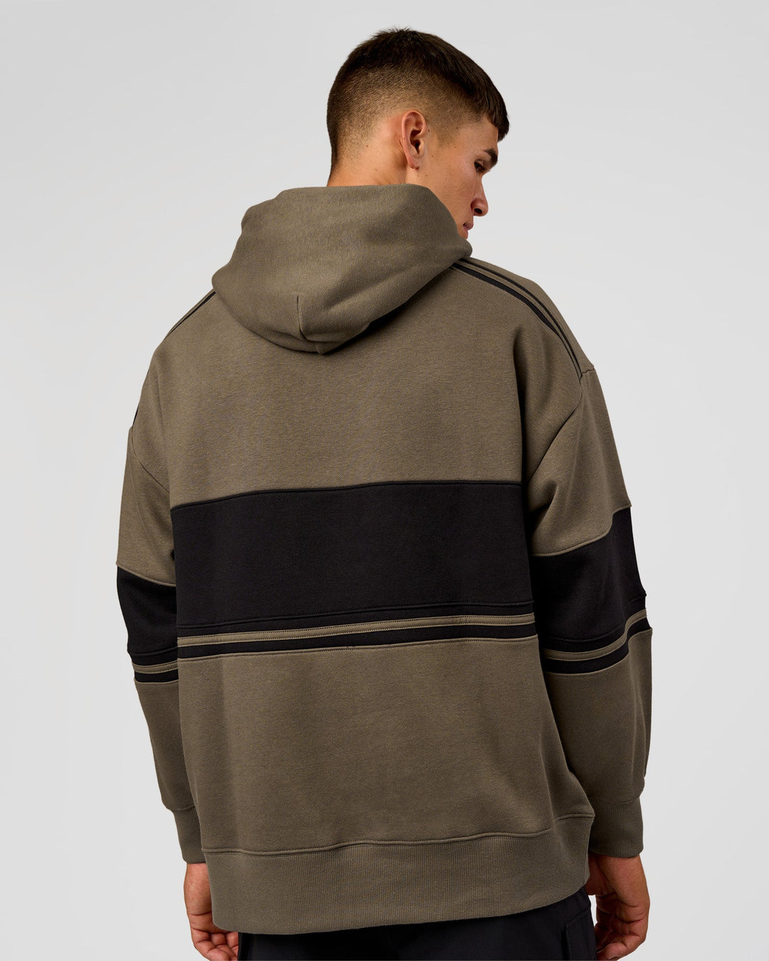 Man wearing A-Team Oversized Hoodie - Walnut Grey-Caviar | Model:Jackson | Size:L