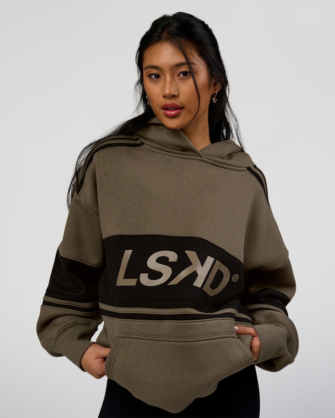 Woman wearing 
A-Team Oversized Hoodie - Walnut Grey-Caviar | Model:Loren | Size:L