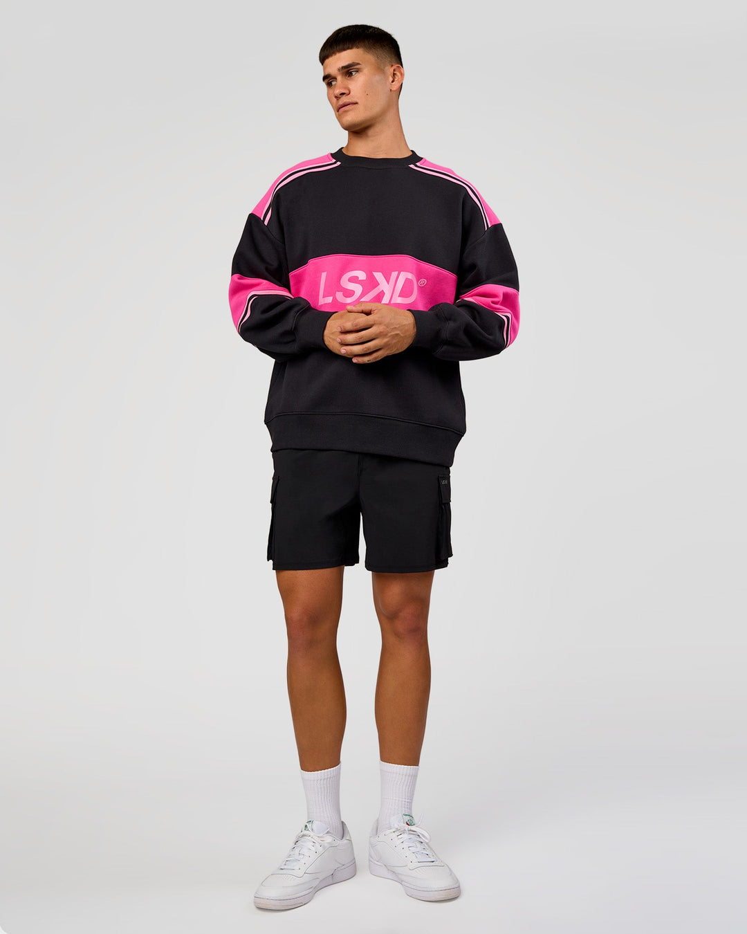 Man wearing A-Team Sweater Oversize - Caviar-Ultra Pink-Candy Pink | Model:Jackson | Size:L