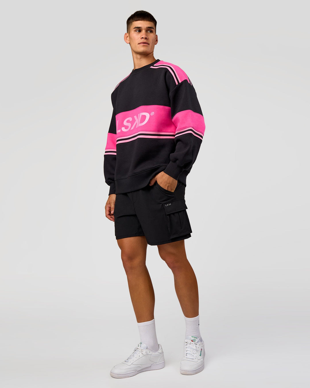 Man wearing A-Team Sweater Oversize - Caviar-Ultra Pink-Candy Pink | Model:Jackson | Size:L
