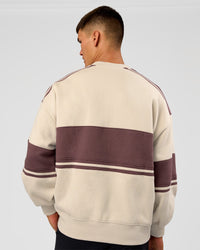 Man wearing A-Team Sweater Oversize - Shale Beige-Cocoa Powder | Model:Jackson | Size:L