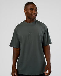 Man wearing Abstract Haze FLXCotton Tee - Carbon Green-Cantaloupe | Model:Sam | Size:L