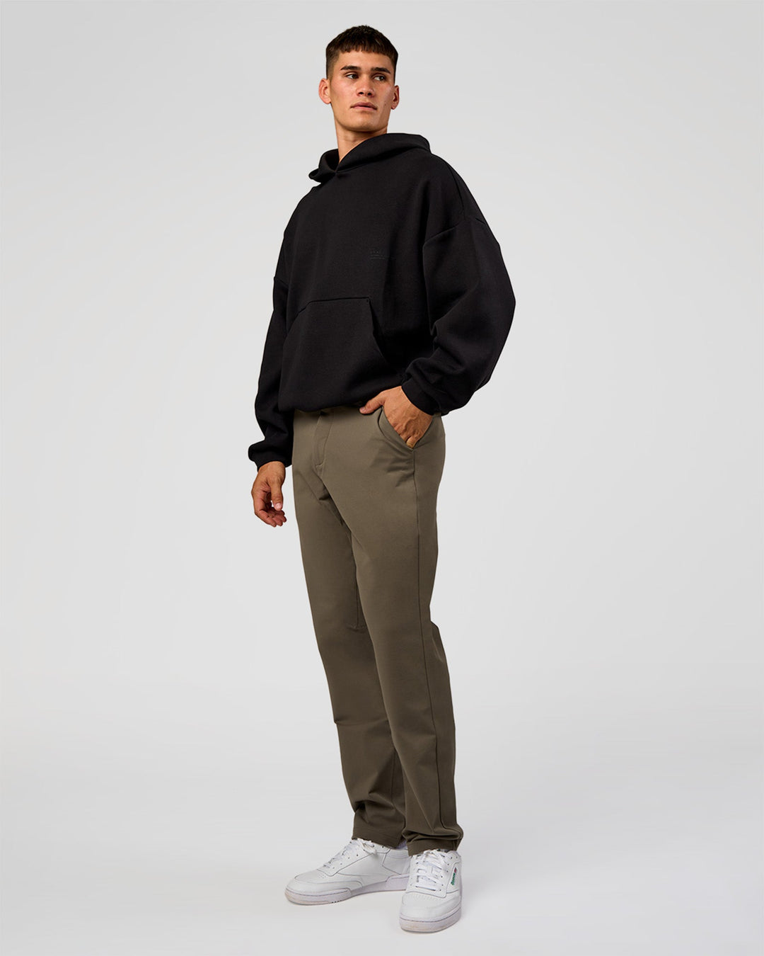 Man wearing AfterDark ZeroCrease Oversized Hoodie - Black | Model:Jackson | Size:L