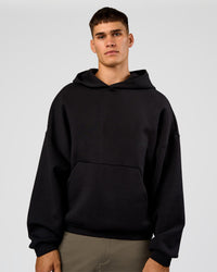 Man wearing AfterDark ZeroCrease Oversized Hoodie - Black | Model:Jackson | Size:L