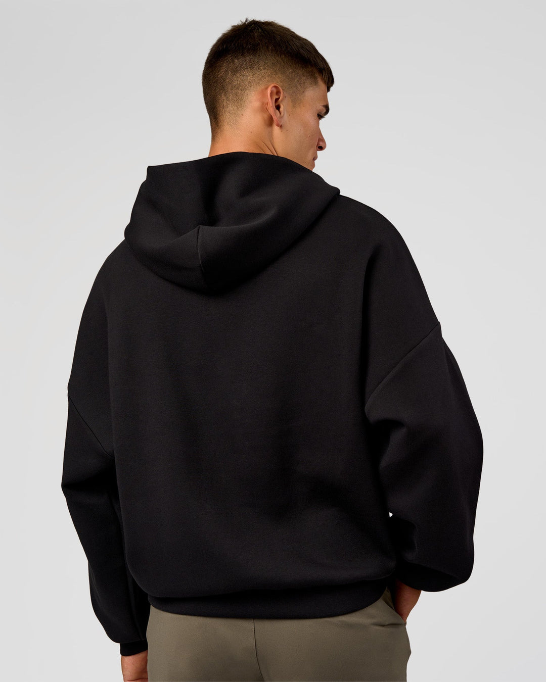 Man wearing AfterDark ZeroCrease Oversized Hoodie - Black | Model:Jackson | Size:L
