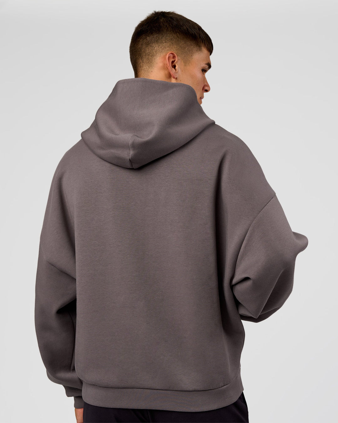 Man wearing AfterDark ZeroCrease Oversized Hoodie - Duskstone | Model:Jackson | Size:L
