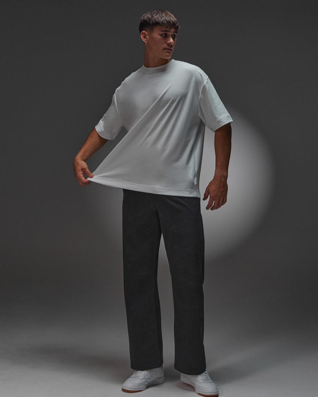 Man wearing AfterDark ZeroCrease Oversized Tee - White | Model:Jackson | Size:L