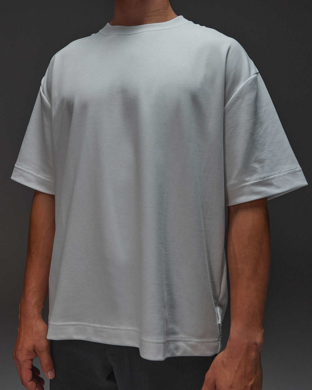 Man wearing AfterDark ZeroCrease Oversized Tee - White | Model:Jackson | Size:L