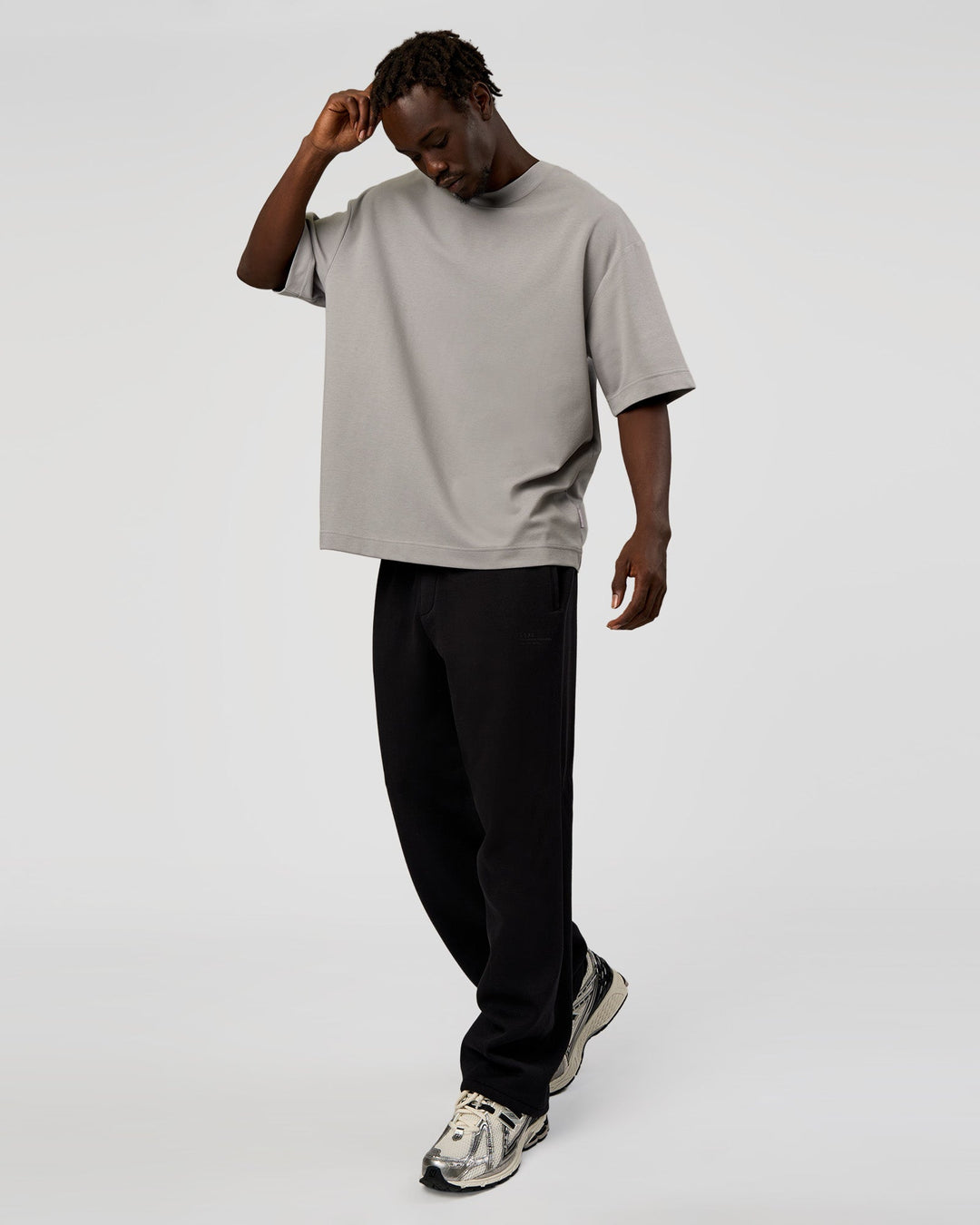 Man wearing AfterDark ZeroCrease Straight Leg Pant - Black | Model:Okello | Size:L