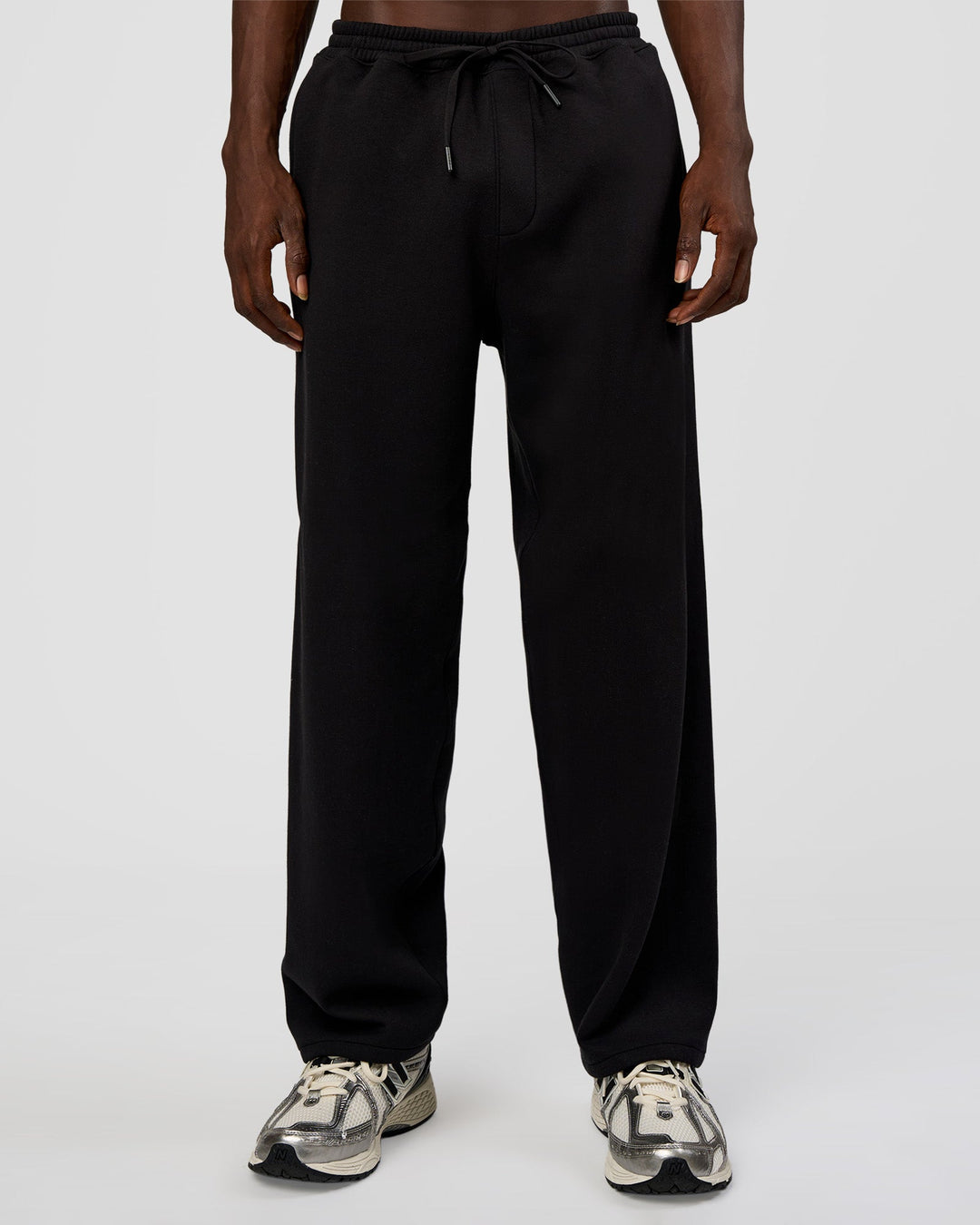 Man wearing AfterDark ZeroCrease Straight Leg Pant - Black | Model:Okello | Size:L