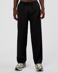Man wearing AfterDark ZeroCrease Straight Leg Pant - Black | Model:Okello | Size:L