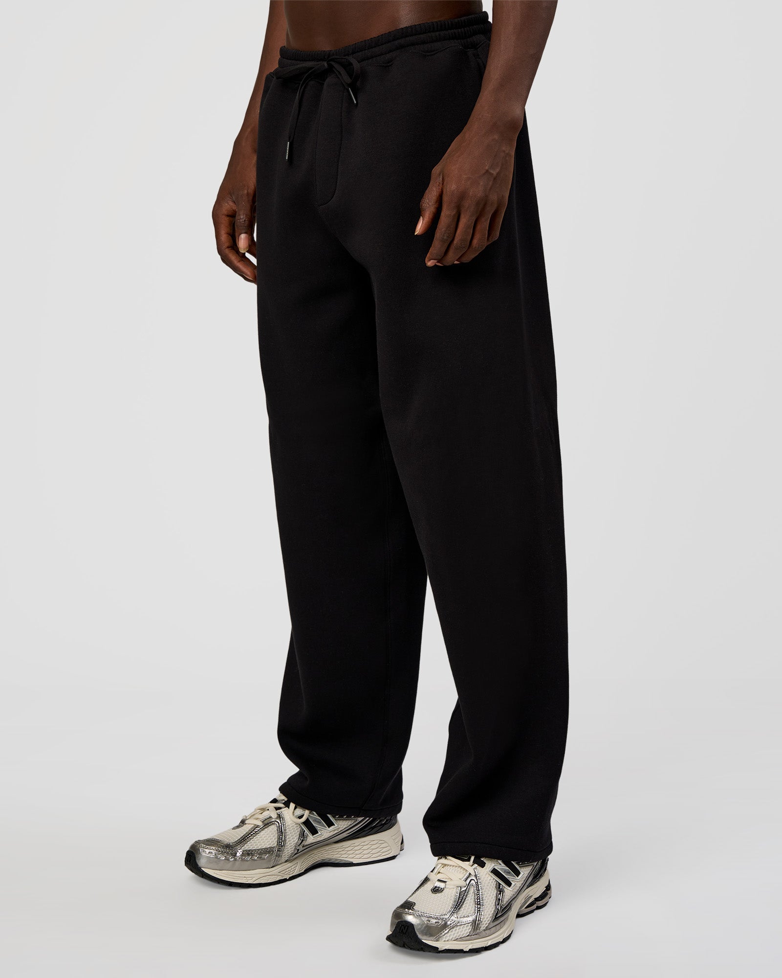 Man wearing AfterDark ZeroCrease Straight Leg Pant - Black | Model:Okello | Size:L