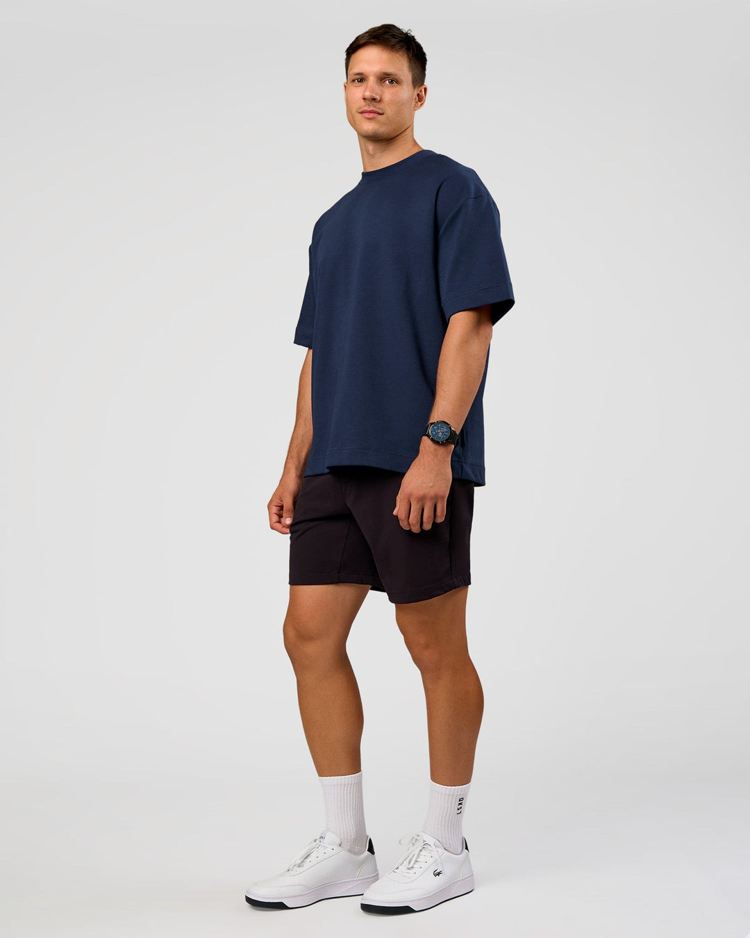 Man wearing All Day ZeroCrease™ Regular 8" Short - Black | Model:Liam | Size:34