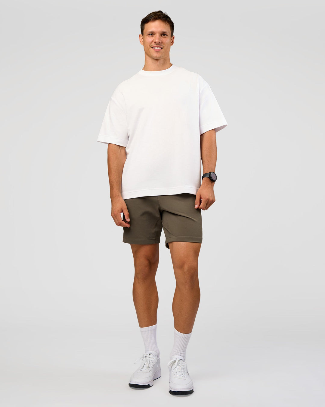 Man wearing All Day ZeroCrease™ Regular 8" Short - Walnut Grey | Model:Liam | Size:34