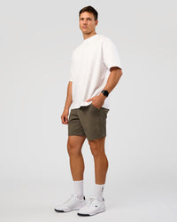 Man wearing All Day ZeroCrease™ Regular 8" Short - Walnut Grey | Model:Liam | Size:34
