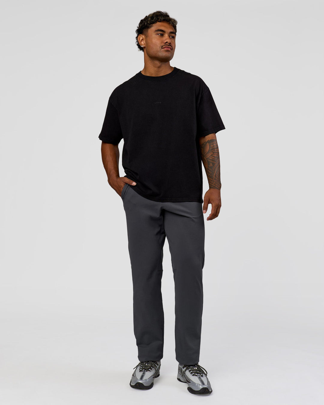 Man wearing All Day ZeroCrease™  Regular Pant - Dark Storm | Model:Xav | Size:L