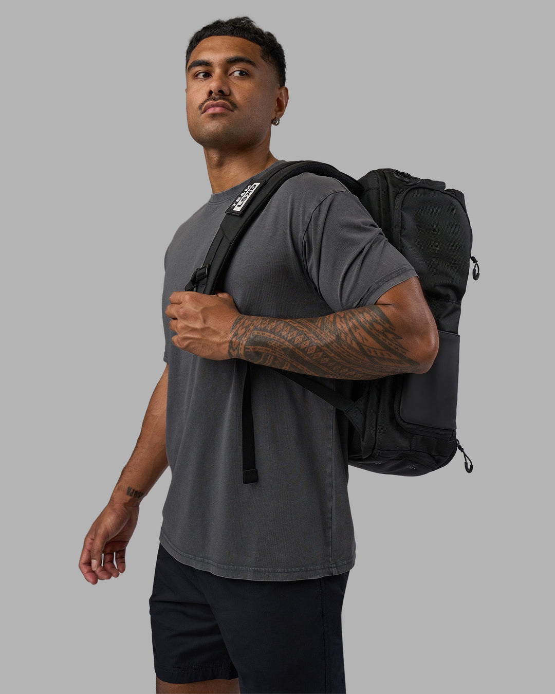 Man wearing Base FLXCotton Tee Oversized - Dark Storm Washed | Model:Xav | Size:L