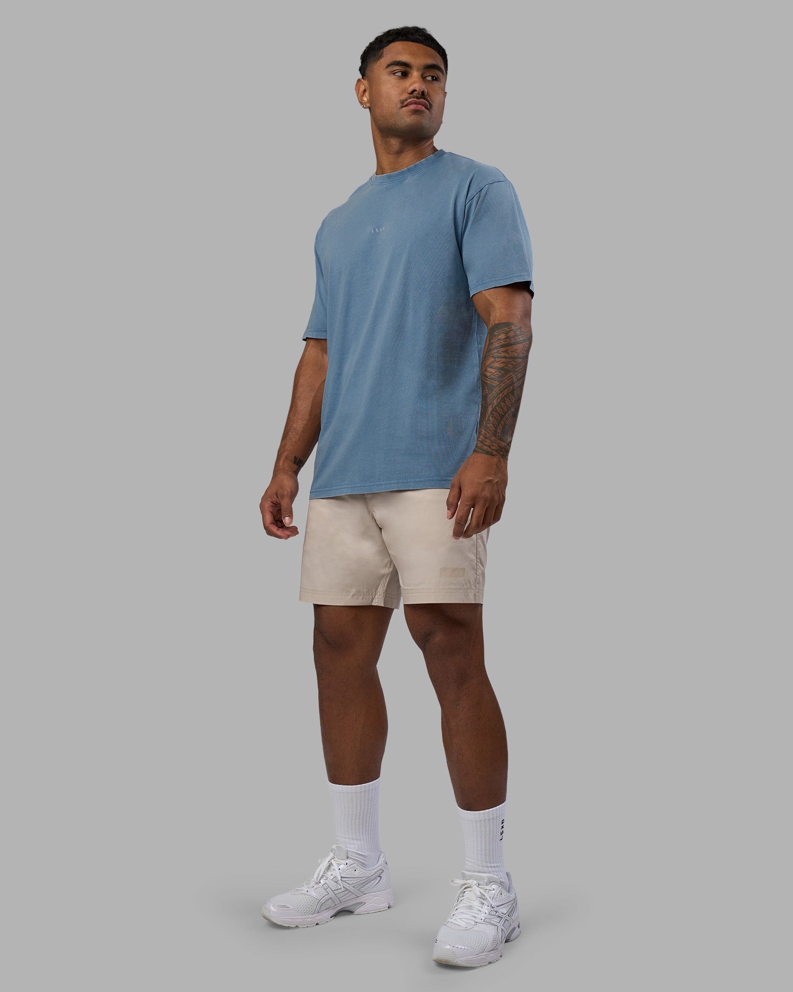 Man wearing Base FLXCotton Tee Oversized - Elemental Blue Washed | Model:Xav | Size:L