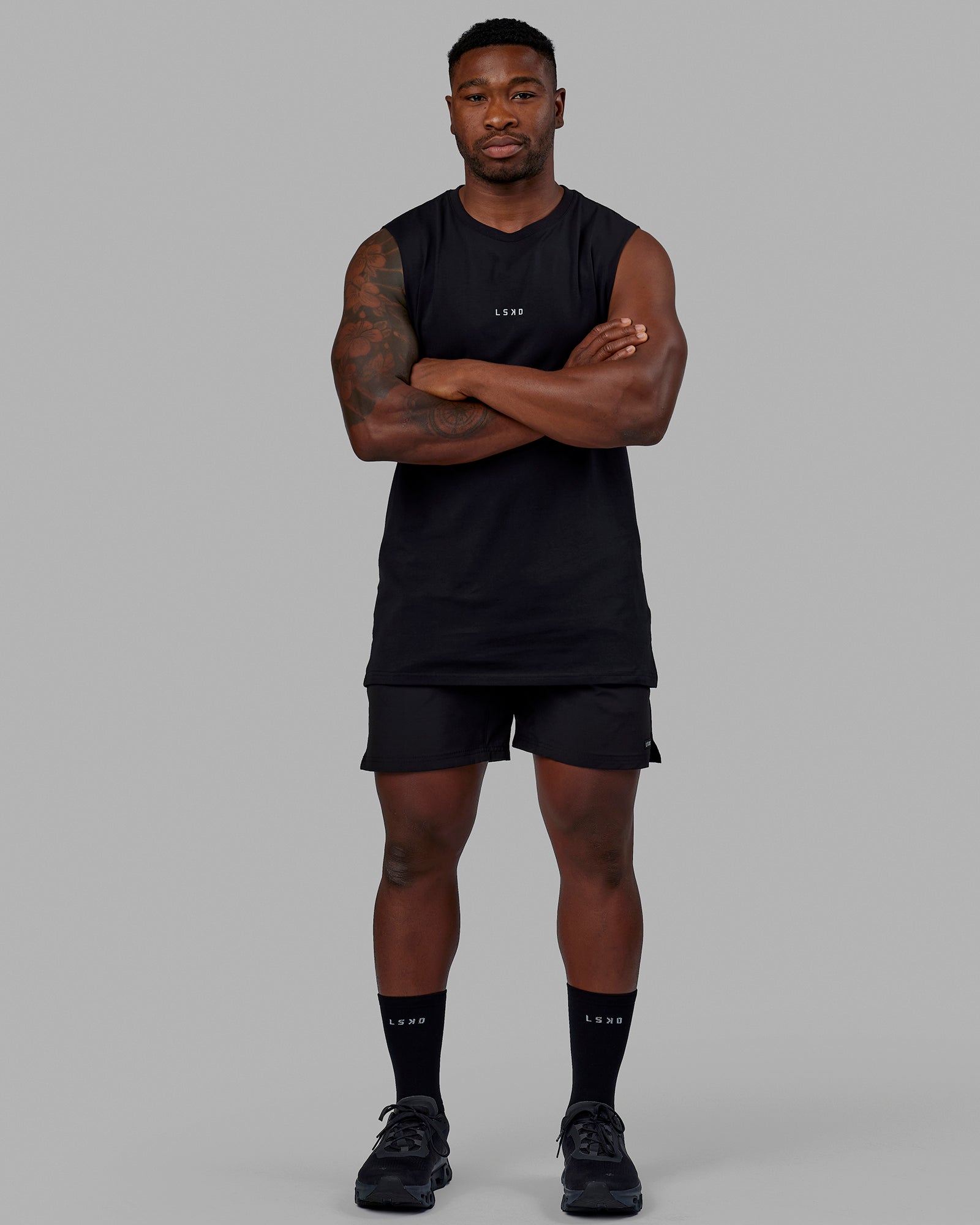 Man wearing Base FLXCotton Tank - Black | Model:Sam | Size:L